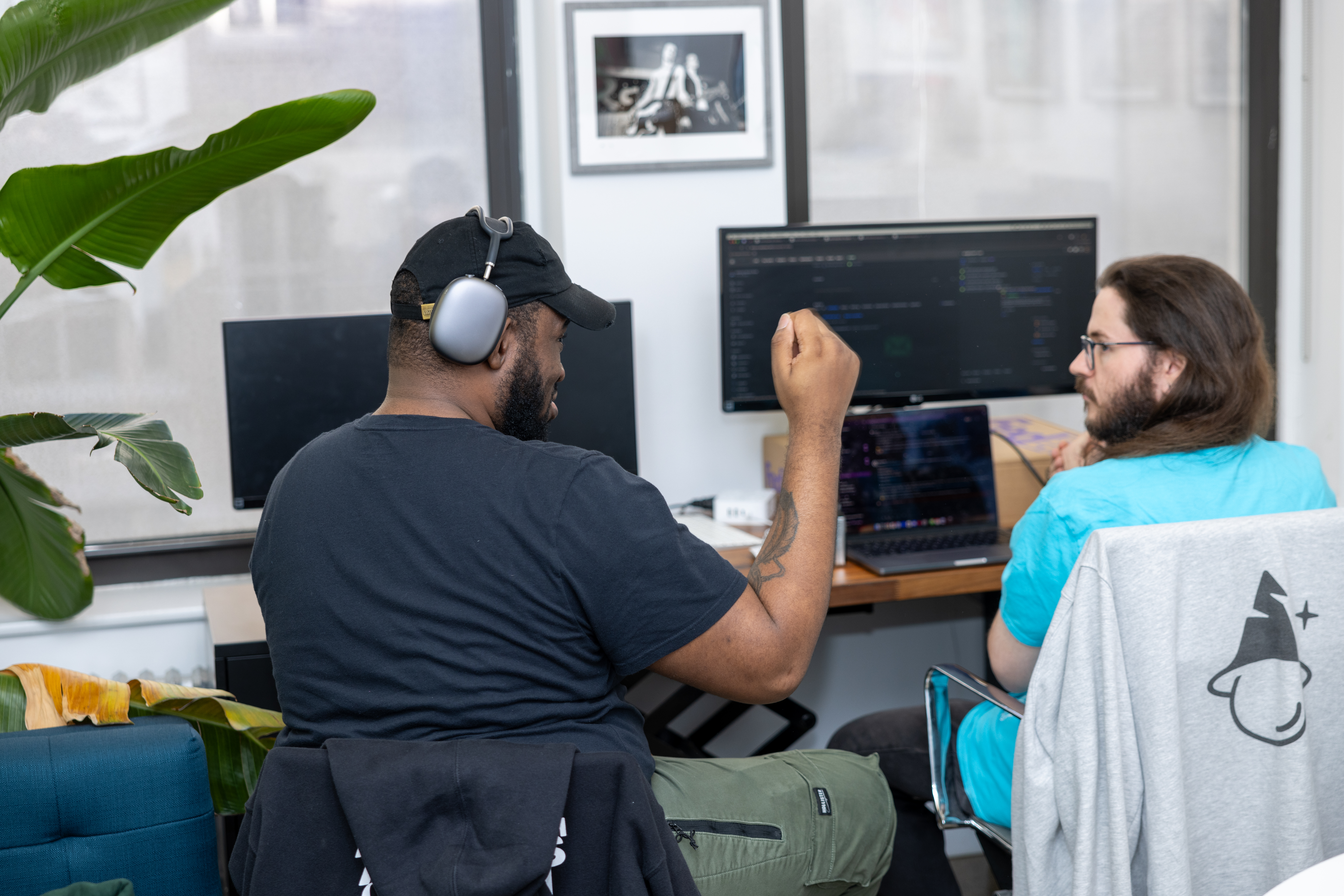 Man and women looking at a computer monitor.
